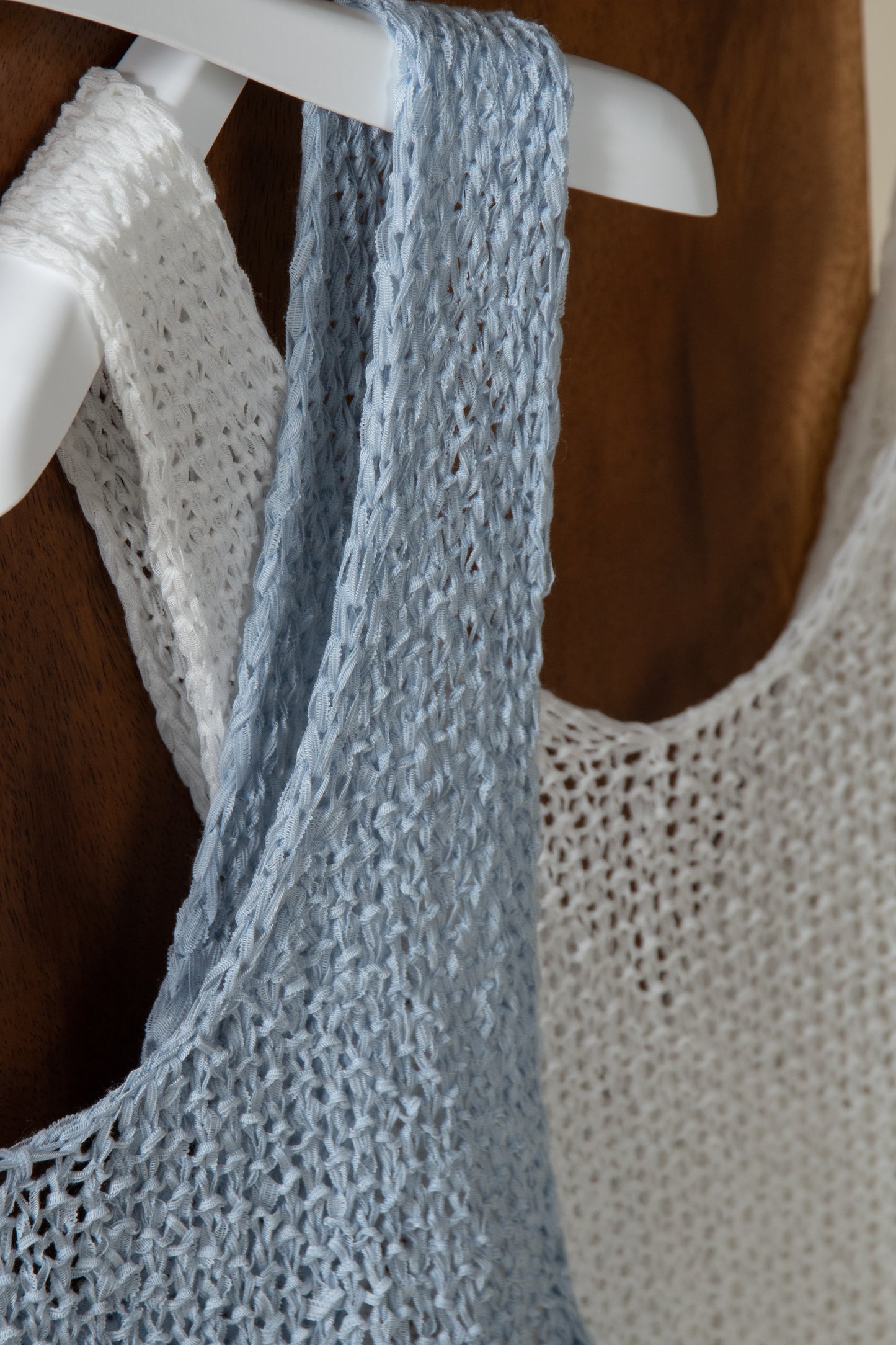 cross sheer knit tops