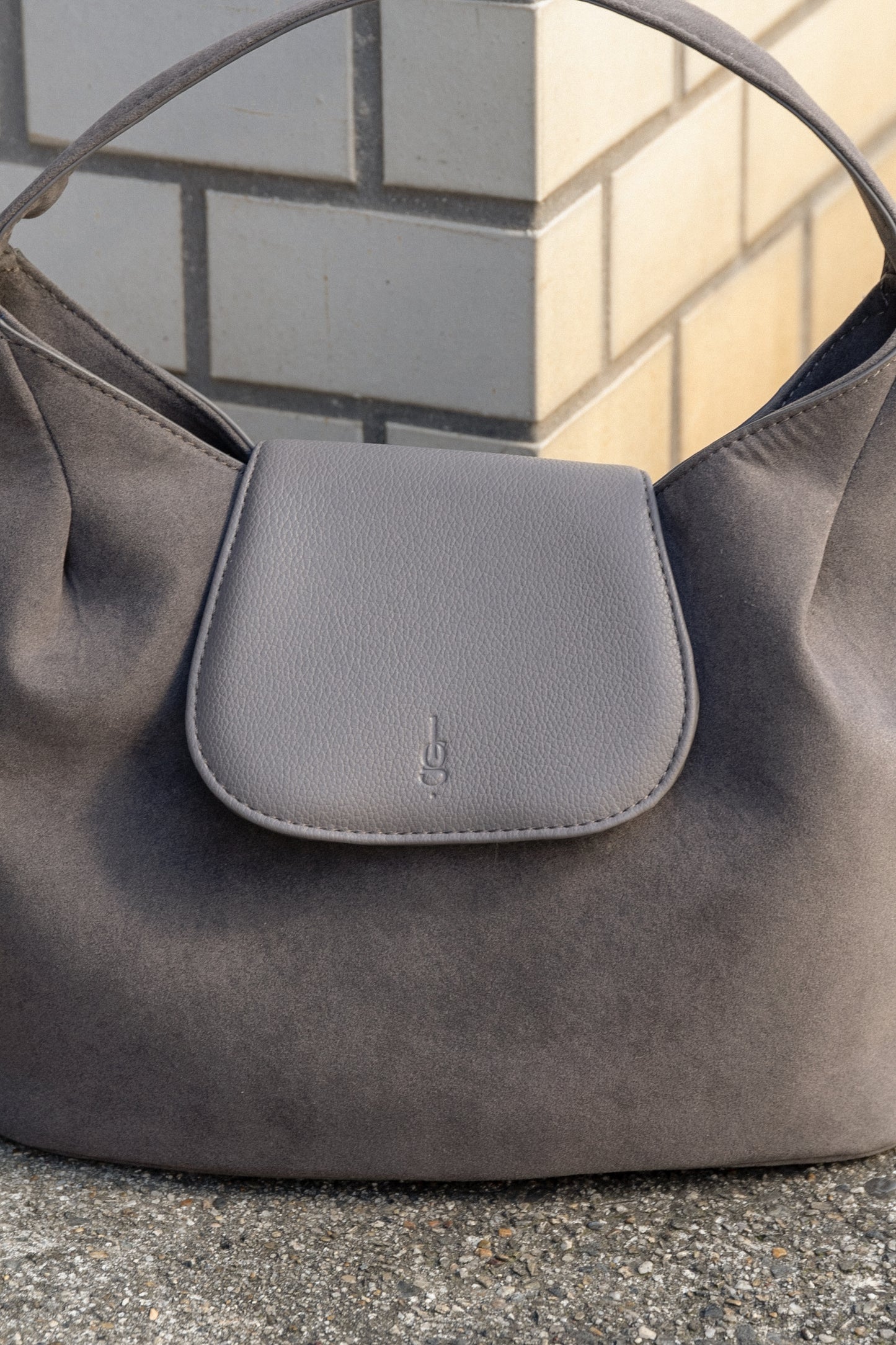 brushed material flap point bag