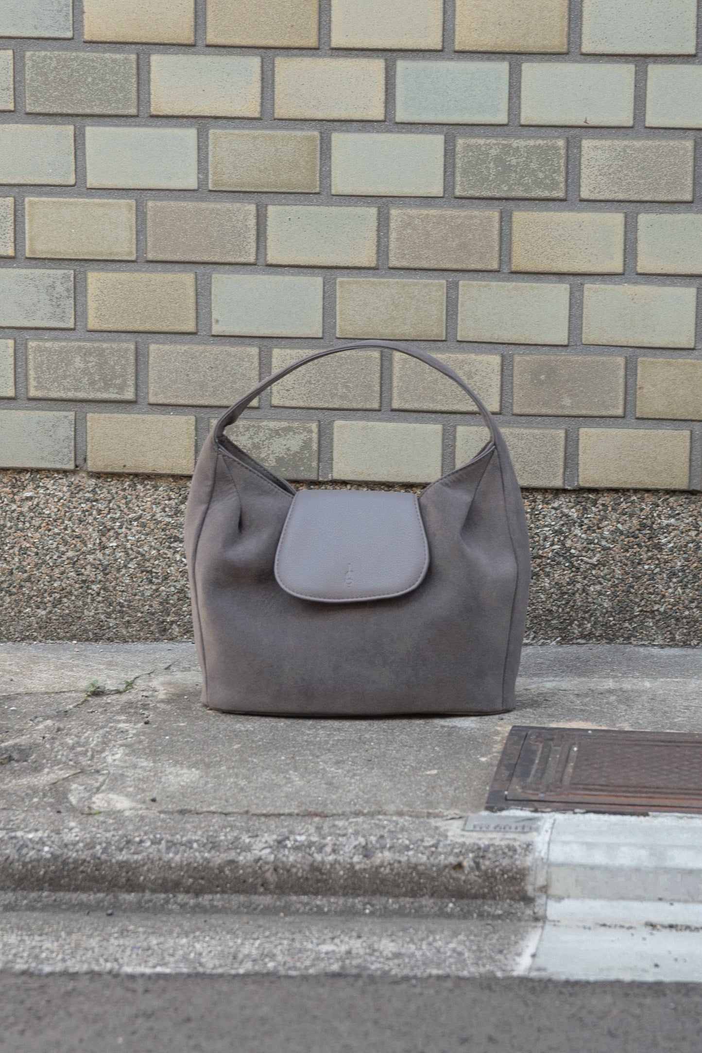 brushed material flap point bag