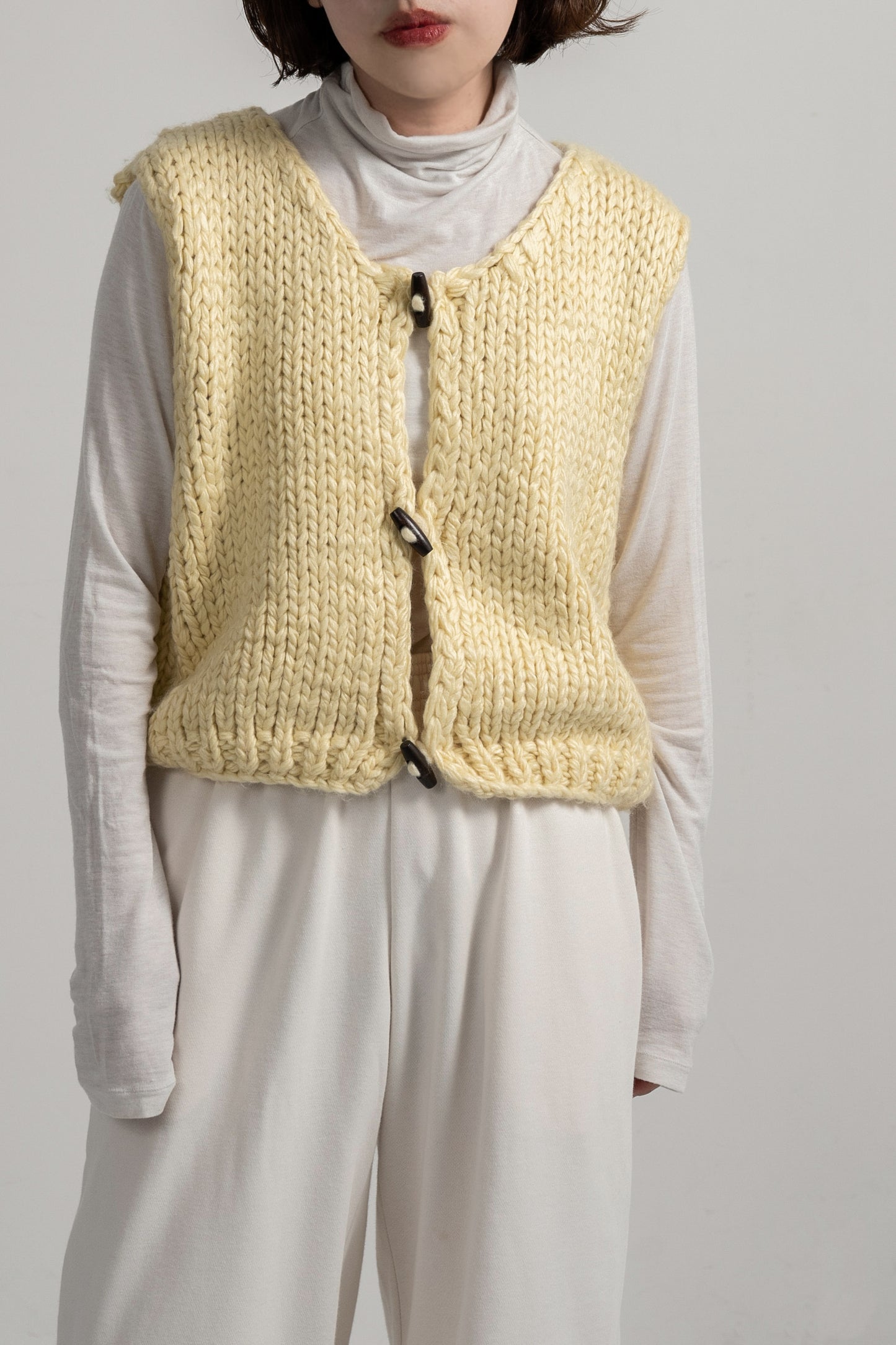 wood button chunky knit vest
