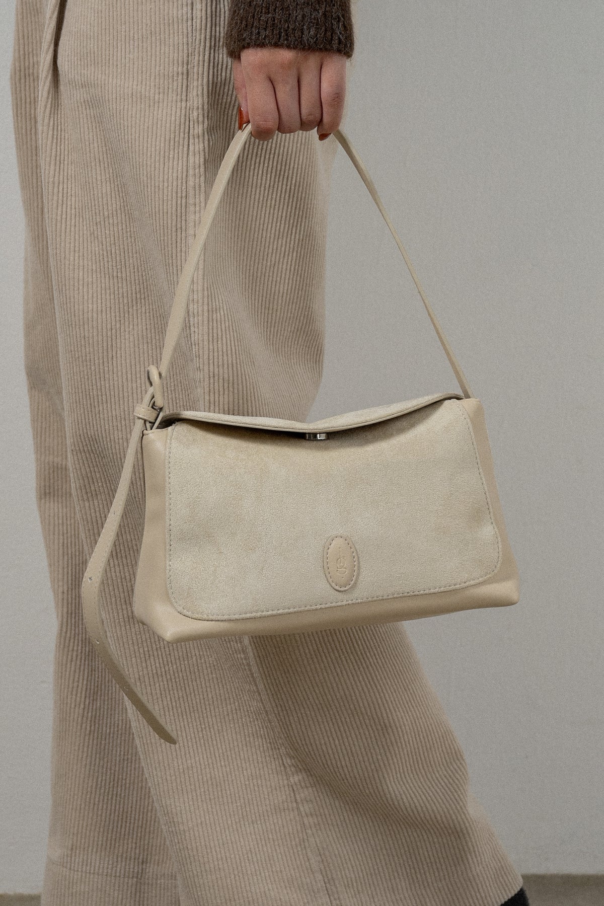 emboss patch round flap one handle bag