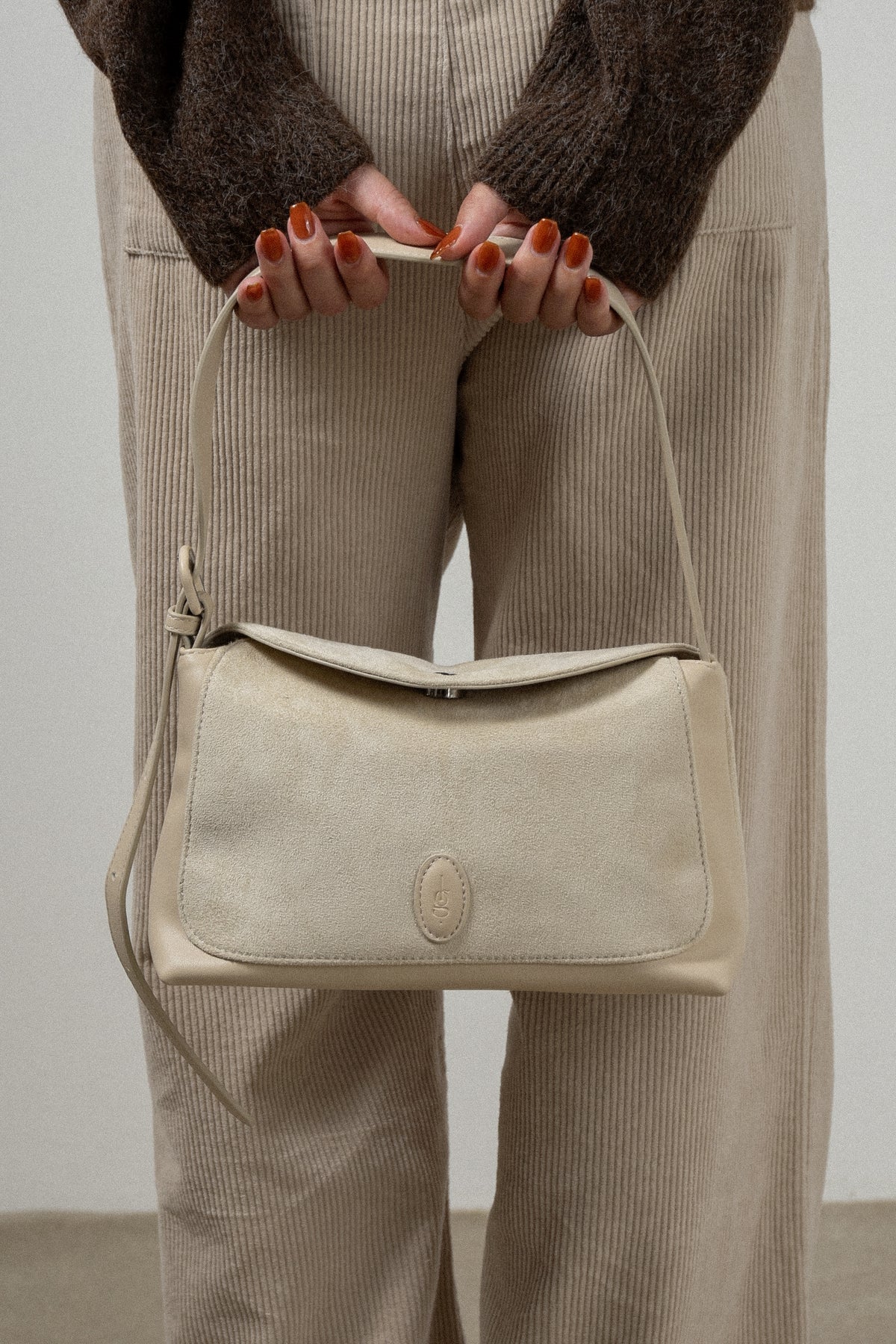 emboss patch round flap one handle bag