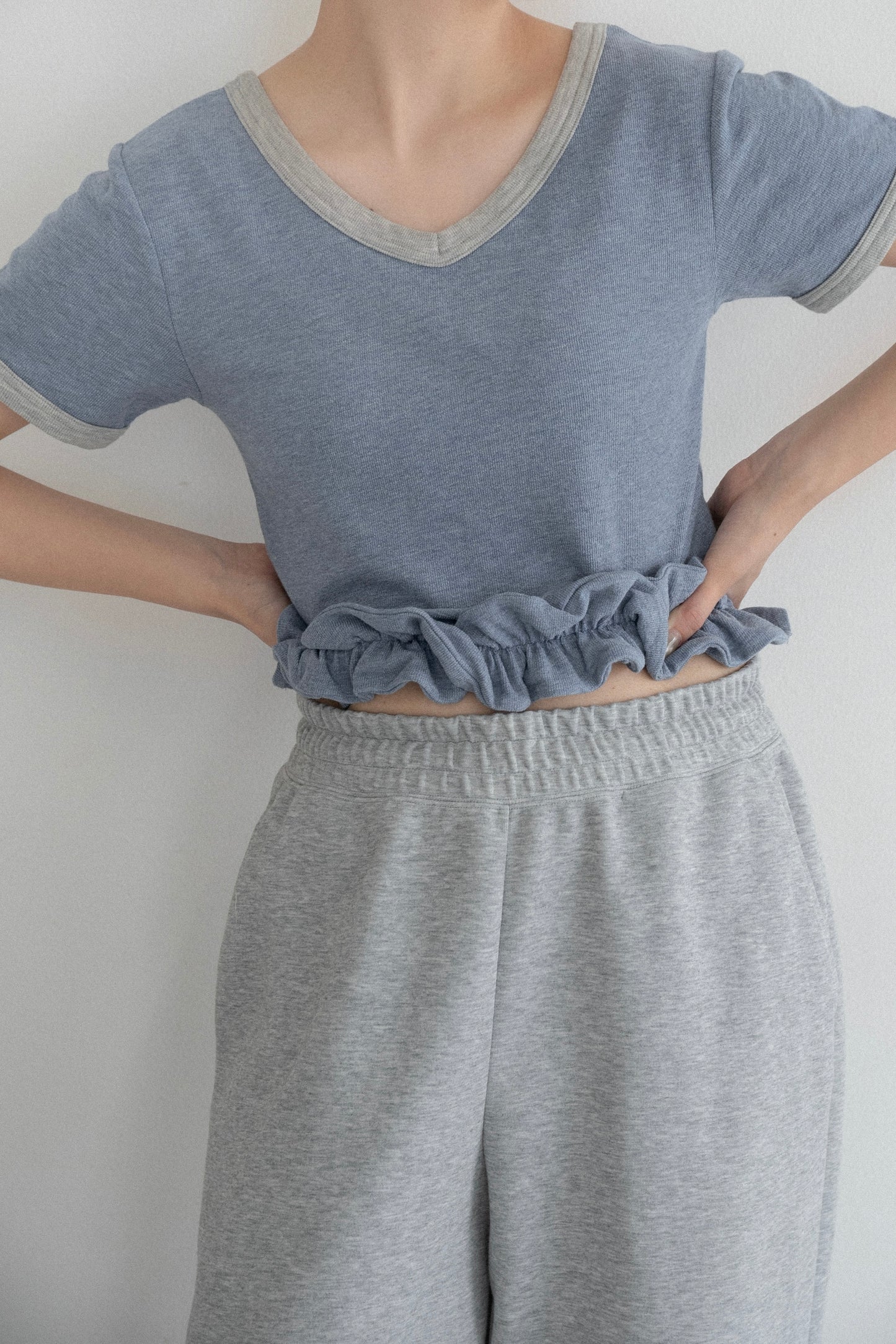 bicolor hem ruffle v tops