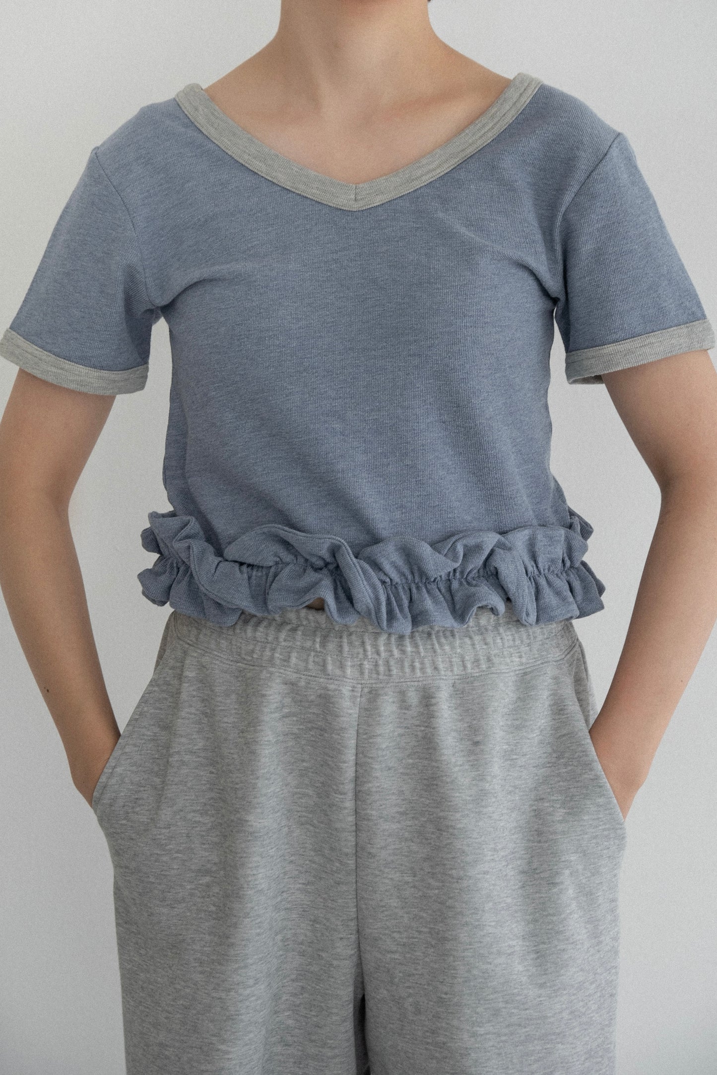 bicolor hem ruffle v tops
