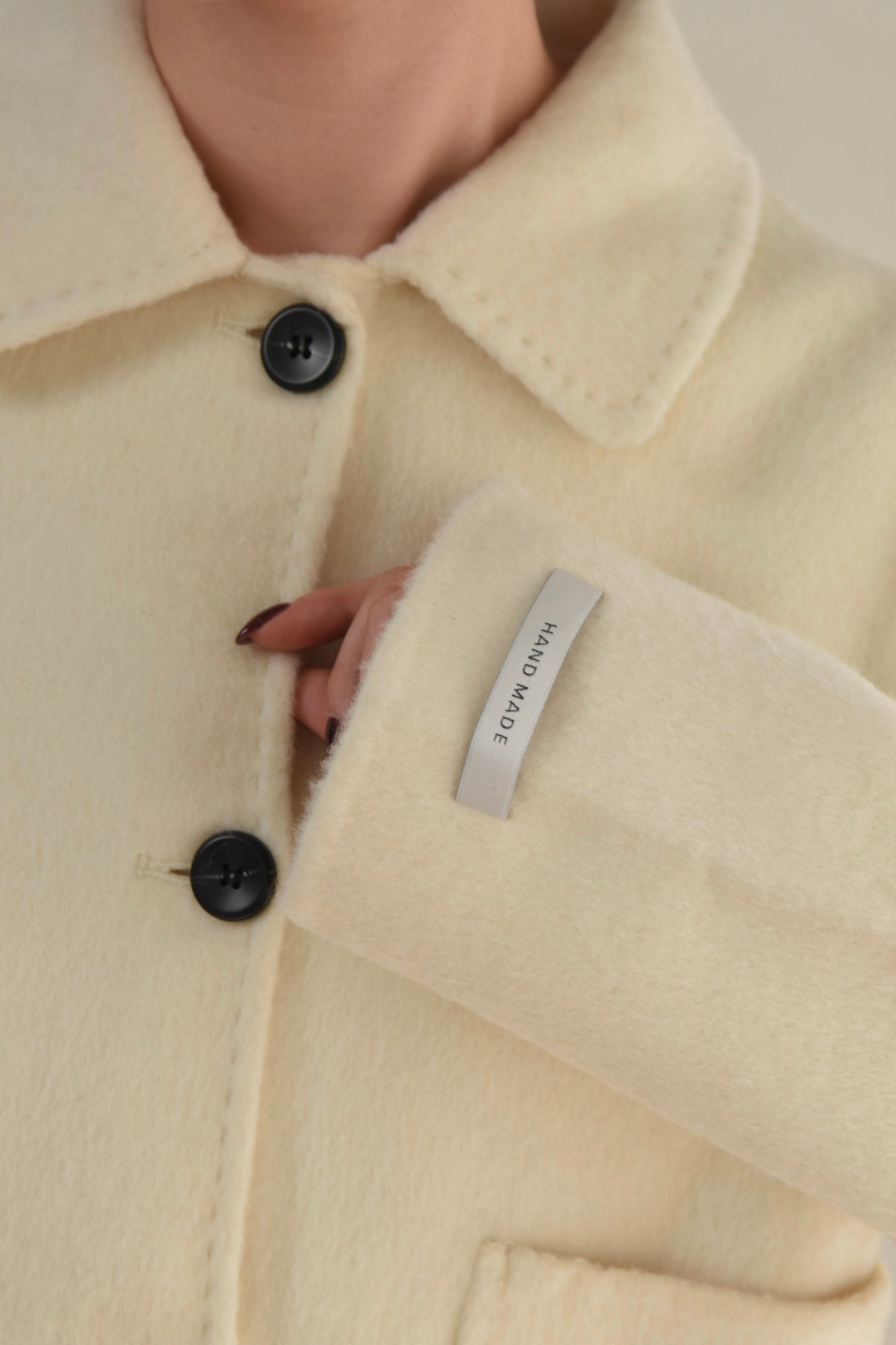 handmade stitch accent short coat