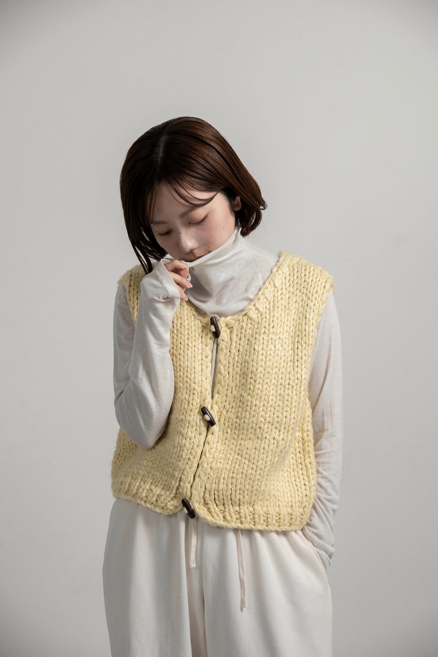 wood button chunky knit vest