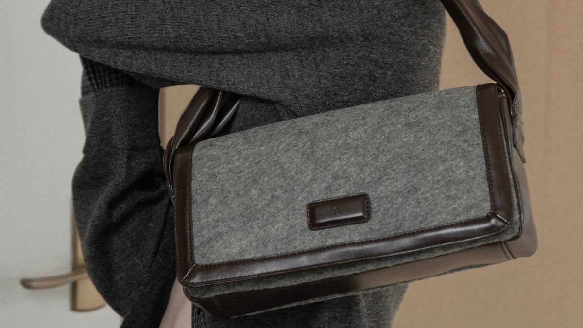 combination material shoulder twist bag